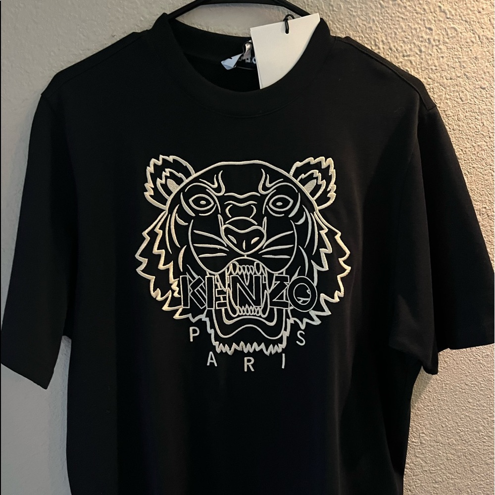Size small, loose fitted t shirt, logo embroidered